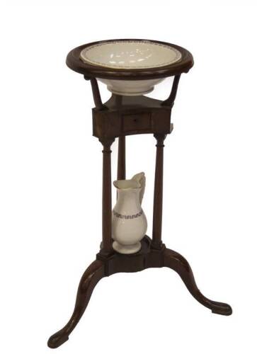 A George III mahogany washstand, with moulded circular top, turned supports and three outsplayed legs with pad feet, with an associated Minton pottery jug and bowl set, 75cm H, 34cm Dia.