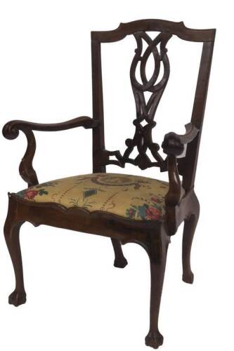 A George III fruit wood carver chair, with shaped cresting rail, inter laced and carved splat back, shaped crook and scroll arms, drop in seat, with cupid's bow rail, slender cabriole legs with ball and claw feet, 70cm W.