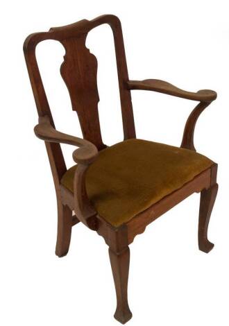 A George II walnut country carver chair, with shaped splat back, scroll arms, on block supports, drop in seat and square legs with block feet, 74cm W.