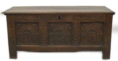 A late 17thC oak coffer, with plank top, Arabesque carved frieze, over three panels with arched decoration and stylised trees, and part carved stiles, 64cm H, 145cm W, 60cm D. - 2