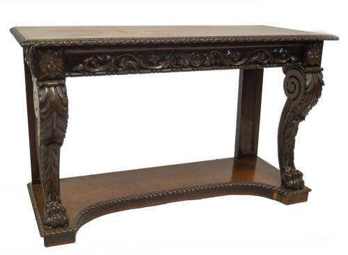 An early 19thC mahogany console table, with egg and dart moulded top, frieze with foliate scrolls and beading, the front legs having acanthus scrolls with the paw feet, slab moulded support backs and nulled, shaped platform base, 79cm H, 131cm W, 53cm D.