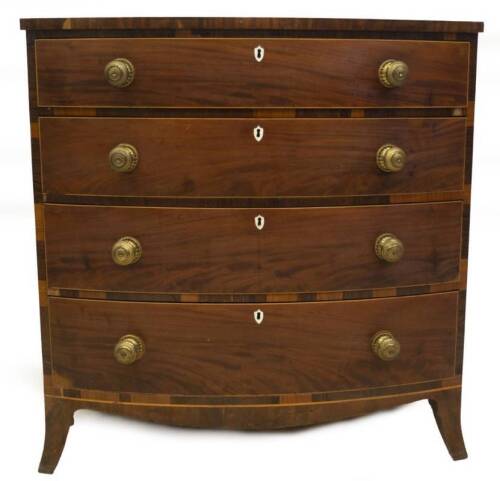 A Regency mahogany bowfront chest, of four graduated drawers with boxwood strung and rosewood crossbanded top, over four drawers with brass circular pressed handles, ivory escutcheons and splay feet, 107cm H, 105cm W, 58cm D.