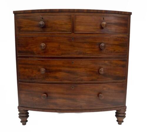 A Regency mahogany bowfront chest, of two short and three long graduated drawers, with oak linings and mushroom knob handles, on turned feet, 109cm H, 107cm W, 55cm D.