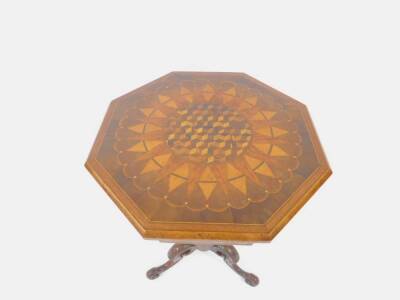 An exhibition quality Victorian octagonal parquetry work table, the hinged top with specimen veneer inlays in a radiating sunburst and scalloped design, and the frieze with varying Tunbridge style inlaid designs, supported upon a tapered spiral column on - 2