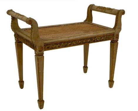 A 19thC Loui XVI style window seat, with cream and parcel gilt gesso decoration, cane seat, on square taper legs, 60cm H, 74cm W, 37cm D.