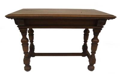 A Victorian oak centre table by Howard & Sons of London, the moulded top having excellent medullary ray exposure, the base having turned and moulded frieze, turned baluster legs and feet joined by a low level moulded H frame stretcher, disc for HOWARD & S