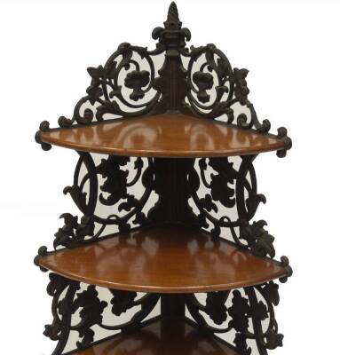 An fine 19thC cast iron corner standing whatnot, formed with scrolling flower heads ivy leaves and columns, retaining four graduated mahogany shelves. label verso, Rendsburg Denmark c.1855. - 2