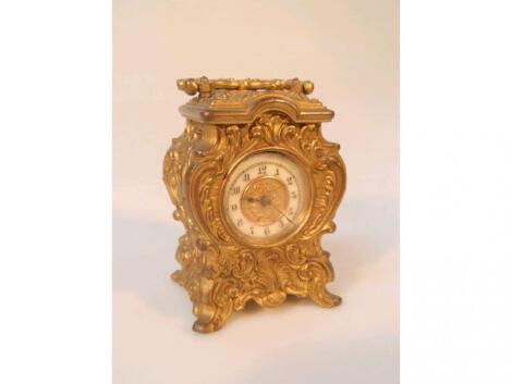 An early 20thC gilt metal carriage clock