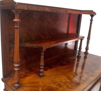 A William IV flame mahogany chiffonier in the manner of Gillows of Lancaster, with double shelved back, on baluster turned supports with tray top, the base having two arch panel doors, revealing shelves enclosed by reeded columns with acanthus scroll and - 4