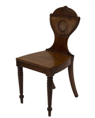 A George IV mahogany hall chair, with reeded and scratch carved urnular back, plain seat, on turned and reeded forelegs, 42cm W.