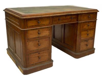A Victorian satinwood and goncarlo alves partner's desk, with double moulded and banded top, having tooled skiver insert, with single frieze drawer over the kneeholes arrangement of four graduated drawers to the left hand pedestal and a double door over t