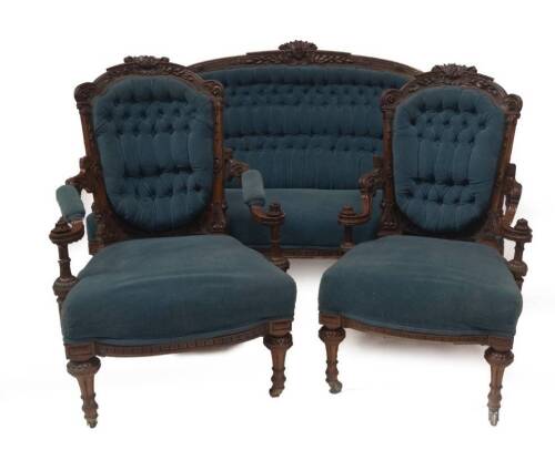 A 19thC exhibition quality carved walnut salon suite, comprising two seater sofa and ladies & gentleman's armchairs, all with highly detailed, decorative show frames, carved with leaves, bell husks and oval patera, the forelegs having inverted balusters w