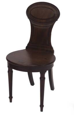 A George IV mahogany hall chair, with a moulded oval and waisted panel back, circular seat and ring turned and taper forelegs, 45cm W.