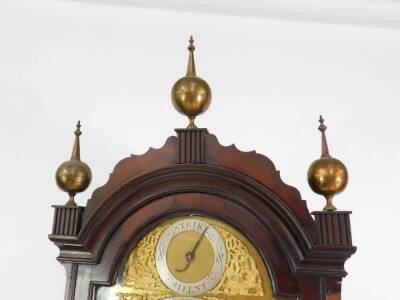 A London quality early 19thC mahogany longcase clock, with an arch canted hood having bell ornaments, flame mahogany case, five pillar eight day movement striking a bell, silvered chapter ring with Roman numerals and alarm, date aperture and strike/silent - 4