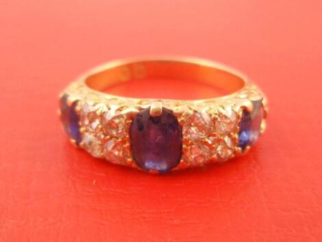 A Victorian cornflower blue sapphire and old cut diamond inline set dress ring