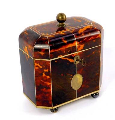 A George III octagonal tortoiseshell tea caddy, with ivory line inlay, the domed lid with silver ball knop opening to reveal twin lidded compartments, the front with silver and reserve, raised on silver ball feet, with key, 15cm H, 13cm W, 8.5cm D. - 3