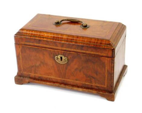 A George III inlaid figured walnut tea caddy, with moulded hinged lid and brass handle and escutcheon, raised upon bracket feet, 27cm H, 14.5cm W, 15cm D.