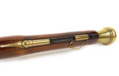 A 19thC brass blunderbuss by Hutchinson, the barrel stamped Dublin MF 1461 and with two proof marks, the lock plate with makers mark, with engraved brass trigger guard and furnishishings, the butt plate numbered to match the barrel, the walnut stock stamp - 3