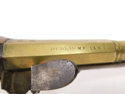 A 19thC brass blunderbuss by Hutchinson, the barrel stamped Dublin MF 1461 and with two proof marks, the lock plate with makers mark, with engraved brass trigger guard and furnishishings, the butt plate numbered to match the barrel, the walnut stock stamp - 6