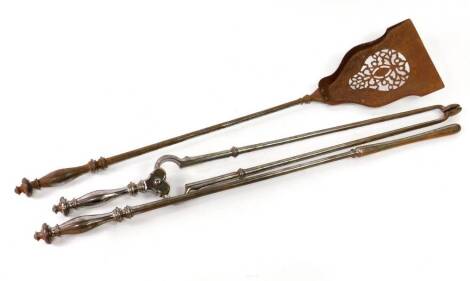 A set of three late 19thC steel fire implements, comprising coal tongs, poker and pan, longest 75cm.