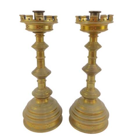 A pair of Victorian Gothic brass altar candlesticks, 39.5cm H.