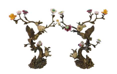 A pair of cast metal garniture of birds on floral boughs with ceramic petals, unsigned, 41cm (2).