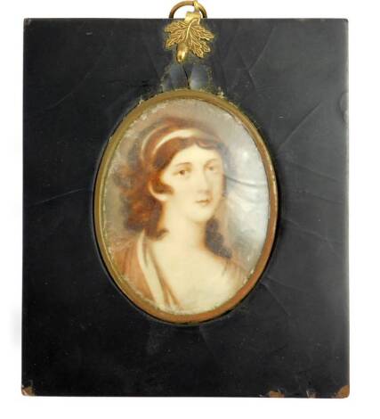 A head and shoulders portrait miniature of Lady Hamilton, with hand painted detail over a printed image, indistinctly signed, and inscribed verso, 8cm x 6cm.