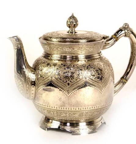 A Victorian silver teapot, of highly ornate design, with chased, engraved and punch decoration of foliate and scroll decoration with lace fringed border, with a monogram IM, and raised upon a tapered foot with cut away outlines, marked Richard & Brown, Lo