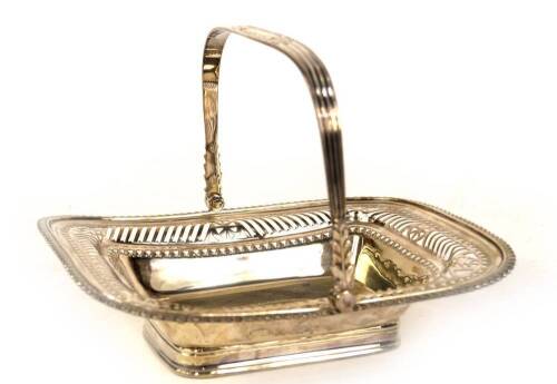 An Edwardian silver oblong cake basket, with swing handle and a gadrooned and pierced framed border, raised on a moulded foot, Sheffield 1902, makers Atkin Bros, 20oz, 25cm L.