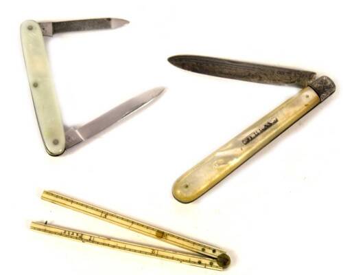 A Victorian silver fruit knife, with mother of pearl handle, Birmingham 1888, a 19thC slender folding ivory ruler 6 1/2", and a penknife. (3)