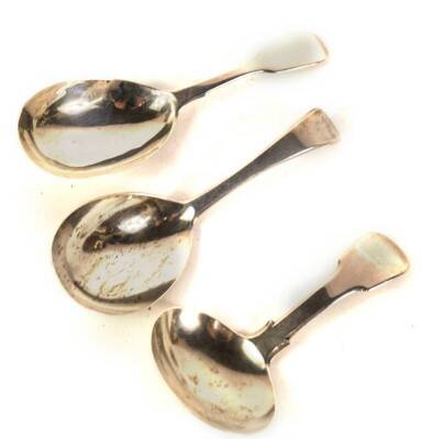 Two fiddle pattern silver caddy spoons, London 1812 and London 1848, and another silver caddy spoon of plain design, London 1839, various makers, 1.35oz. (3)