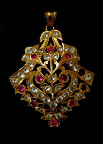 An Asian design lozenge shaped pendant, set with pink and white stones, probably ruby and imitation diamond, with stamping to rear maker SJH, and three undistinguishable numbers, (two stones missing), 4cm high, 5.7g all in