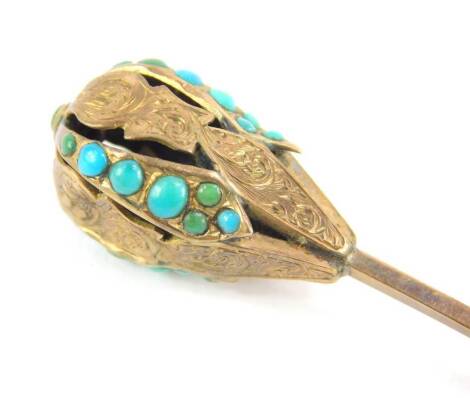 A Victorian turquoise set stick pin, with ball top design, with partial scroll engraving and set with turquoise stones, yellow metal, unmarked, 8cm high.