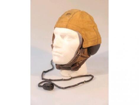 A WWII flying helmet with canvas cover