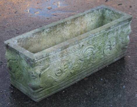 A 20thC stone garden planter, of rectangular form, carved with a repeat floral pattern, 71cm W.