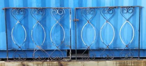 Two late Victorian cast iron gates, each with compressed oval centres, partially painted, 84cm H, 100cm W.