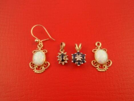 A pair of opal set earrings (one wire missing) and two small stone set pendants