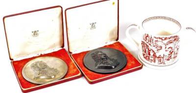 A Royal Mint Sir Issac Newton warden plaque, in fitted case, 11cm Dia., another in black and a Matthew Clark commemorative loving cup, dated 1997. (3)