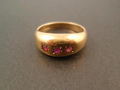 A 9ct gold red stone set signet ring