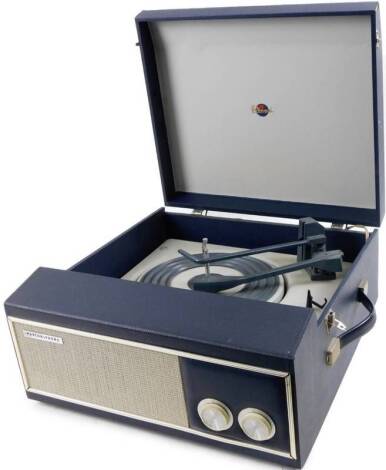 A vintage Marconi Marconiphone turntable, with grill speaker front set with articulated tunning knops with a interior turntable, in pressed case, 40cm W.