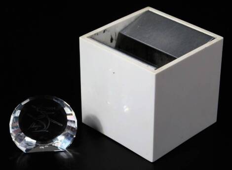 A Danese Malano ashtray, of square form with metal top, marked beneath, 6cm H, 6cm W, 6cm D, and a signed Swarovski crystal sculpture dated 2004, in outer box. (2)