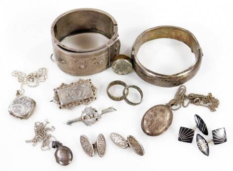 A small quantity of silver and silver plated costume jewellery, to include two silver hinged bangles, one of buckle form, a Victorian silver floral bar brooch, a Victorian silver engraved bird brooch, silver plated locket and chain, cuff links, two furthe