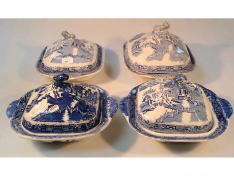 Two pairs of blue and white willow pattern tureens and covers