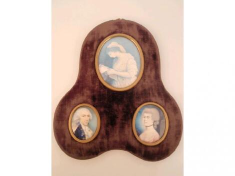 An early 19thC portrait miniature group of three oval miniatures