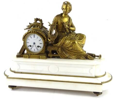 A 19thC French gilt brass figural mantel clock, the enamel dial seated between two books and a female harpist figure on a stool, on a white marble stepped base with brass detail and feet, 55cm W, 40cm H.