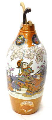 A 19thC Japanese Kutani porcelain vase, decorated with female figures, flowering branches, within iron red and gilt borders, interspersed with flower vases on a black ground, the neck and rim removed, 84cm H and three walking sticks.