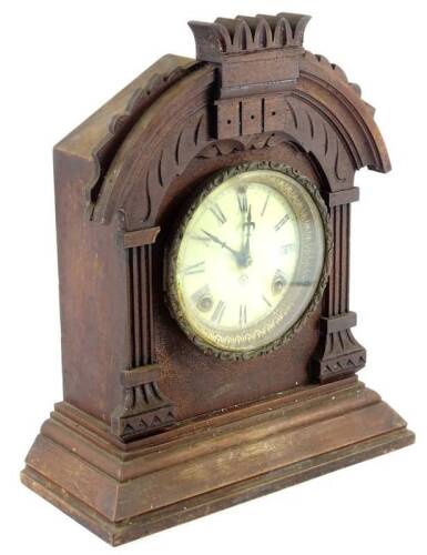 An American mantel clock, in a walnut case, the dial with Roman numerals by the Ansonia Clock Company, 36cm H.