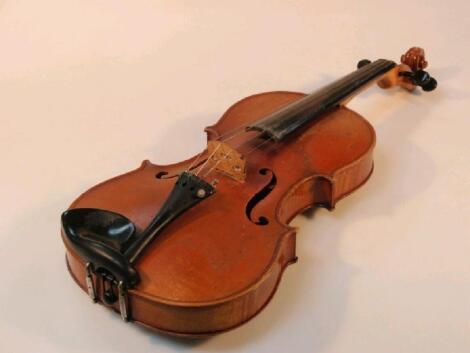 A French students violin with single piece back and paper label