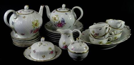 A Hutschenreuther Dresden porcelain part tea service, to include two teapots, muffin dish and cover, covered sugar bowl, cups, shaped dish etc.