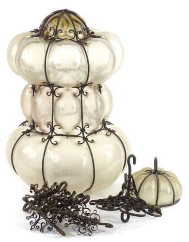 A Continental wrought iron and grey glass hall lantern, with suspension chains etc., 36cm H.